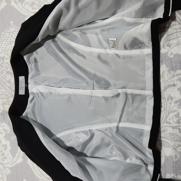 Classic black Tahari blazer with white trim, zipper pockets and sleeves. - Picture 11 of 12